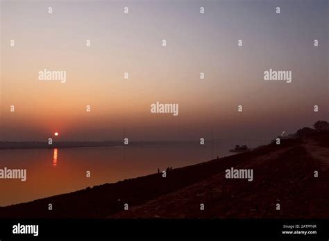 Sun rise in Varanasi opposite Ganga river Stock Photo - Alamy