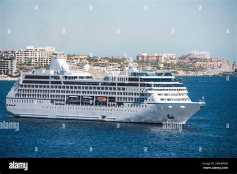 A cruise ship lays at anchor in the port of Cabo San Lucas, Mexican ...