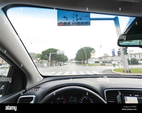 View from inside a car on a part of dashboard with a navigation unit Stock Photo - Alamy