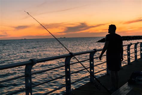 fishing-pier-sunset | Tropical Breeze Resort