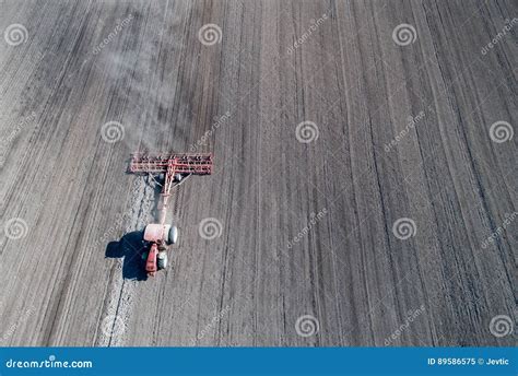 Tractor harrowing soil stock image. Image of farm, high - 89586575