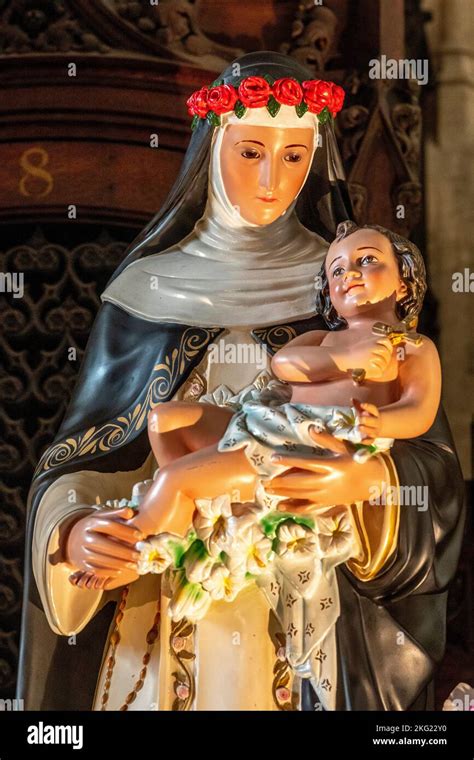 St Rose of Lima statue in Saint-Germain-l'Auxerrois catholic church, Paris Stock Photo - Alamy