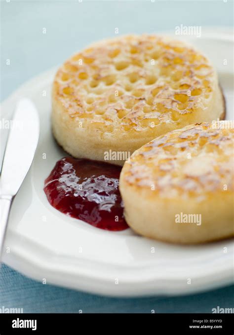 Crumpets with Butter and Jam Stock Photo - Alamy