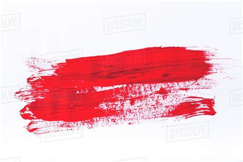 Abstract painting with bright red brush strokes on white - Stock Photo - Dissolve