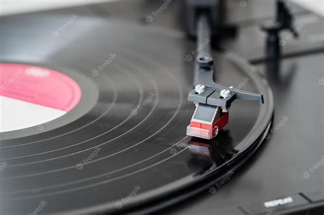 Premium Photo | Record player playing a vinyl record. black platter