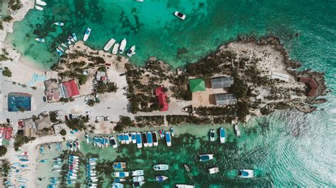 Aerial view of a small island with boats and a dock · Free Stock Photo