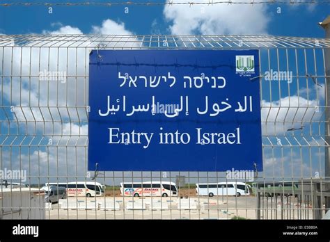 A sign which reads Entry into Israel at the Erez border crossing also Beit Hanoun Crossing on ...