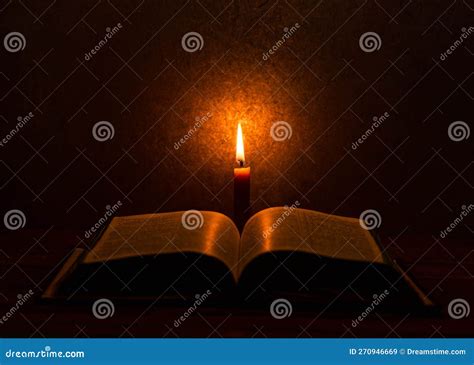 Open Bible Illuminated by a Single Candle Stock Image - Image of relaxing, glow: 270946669