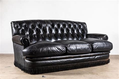 Black Leather Tufted Sofa with Tufting and a Fringed Base at 1stDibs ...