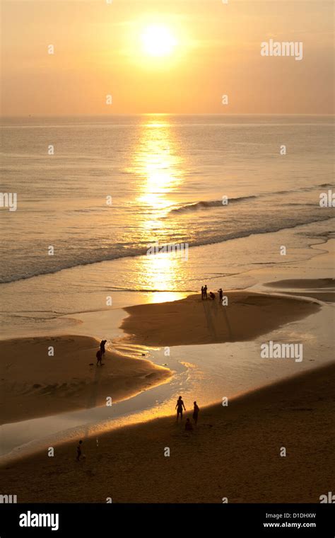 Sunset on Varkala beach in Kerala Stock Photo - Alamy