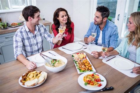 Smiling couple friends eating together — Stock Photo © Wavebreakmedia #98062356