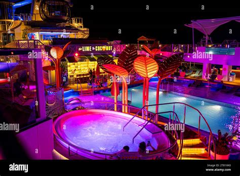 Pool deck of Royal Caribbean's Odyssey of the Seas at night Stock Photo - Alamy