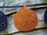 Image of Grinning evil orange glitter pumpkin decoration | CreepyHalloweenImages