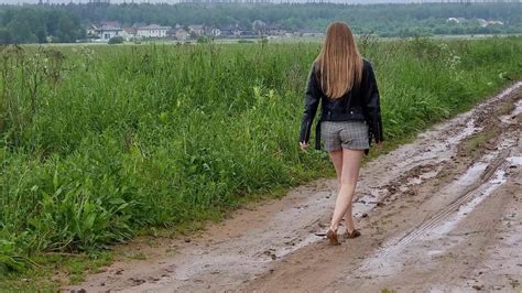 Aliona is walking barefoot in mud, barefoot muddy walk, muddy feet ...