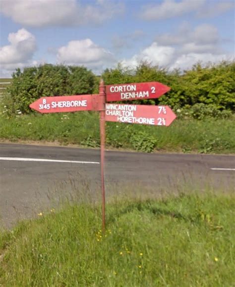 One of Dorset's famous red sign posts | Red sign, Dorset, Sign post