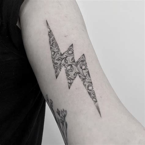 Floral lightning bolt tattoo by Oliver Whiting - Tattoogrid.net