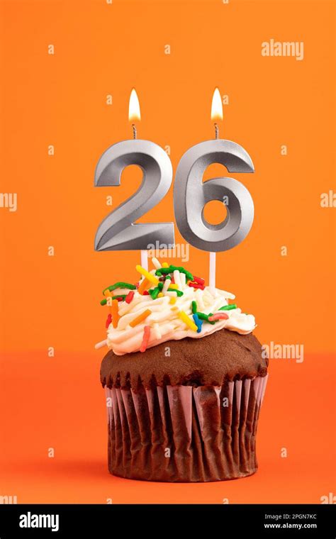 Birthday cake with candle number 26 - Orange foamy background Stock Photo - Alamy