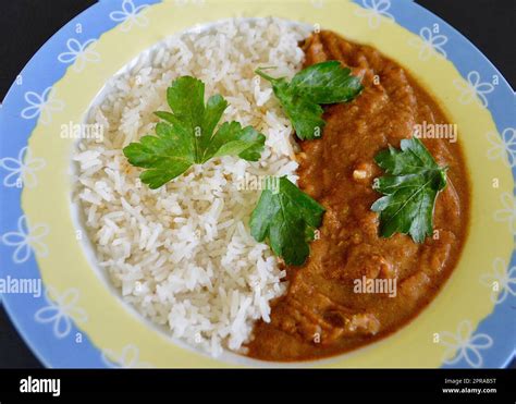 Lamb rogan josh and rice Stock Photo - Alamy