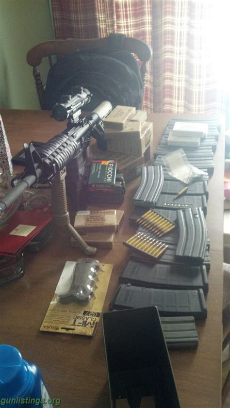 Gunlistings.org - Rifles Bushmaster AR-15/with Accessories