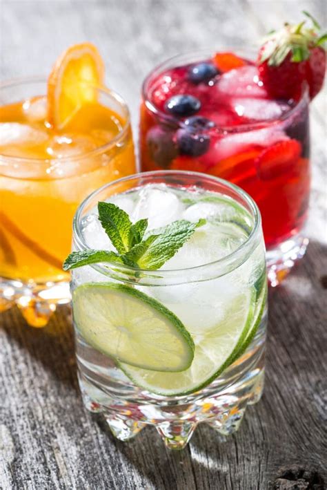 Assortment Of Iced Fruit Drinks On Wooden Background, Vertical Stock Image - Image of refreshing ...