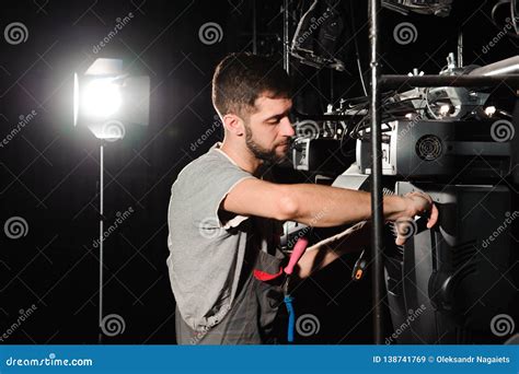 The Lighting Engineer Adjusts the Lights on the Stage Stock Image - Image of machine, event ...