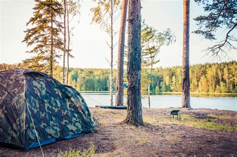 Forest Scenery With Camping Tent On Bank Of Lake Stock Photo - Image of ...