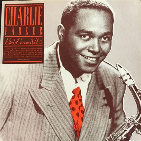 a man in a suit and tie with a saxophone on the cover of his album ...