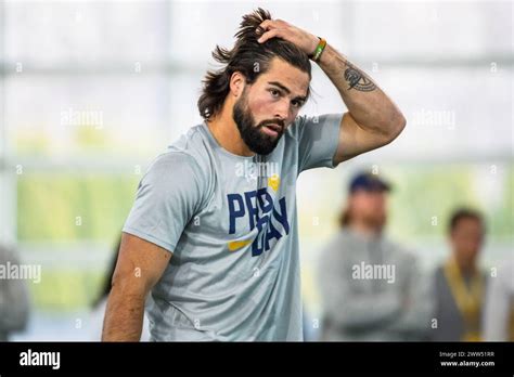 Notre Dame quarterback Sam Hartman fixes his hair between drills during ...