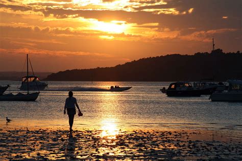 Poole Harbour sunset looking over to Brownsea Island | Sunset, Outdoor, Island