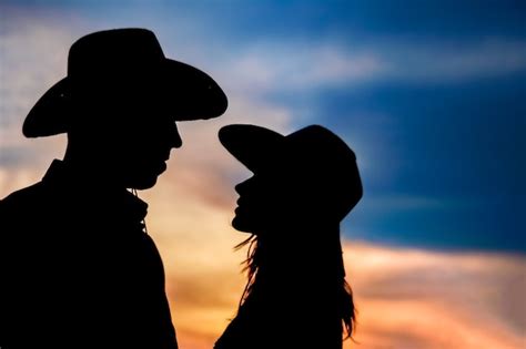 Premium Photo | Happy cowboy couple together at sunset silhouette