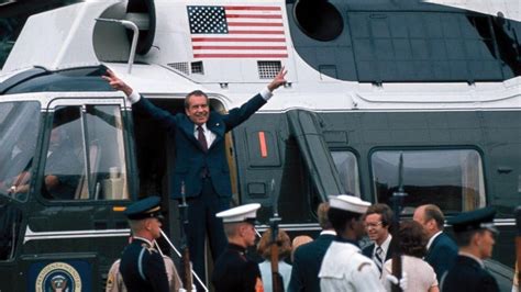 Richard Nixon giving his final “peace sign” before officially resigning due to the Watergate ...