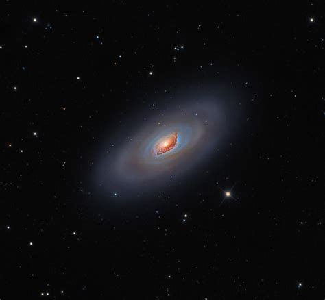 M64: The Black Eye Galaxy : This big, bright, beautiful spiral galaxy is Messier 64, often ...