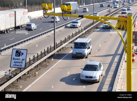 Average speed cameras & sign on the M25 motorway during contra flow operation & because of road ...