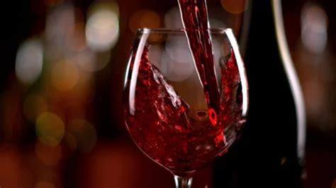 Super slow motion of pouring red wine fr... | Stock Video | Pond5