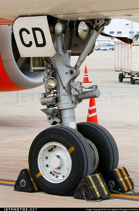 an airplane wheel is on the ground next to some cones