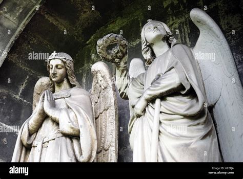 Stone statues of two angels Stock Photo - Alamy