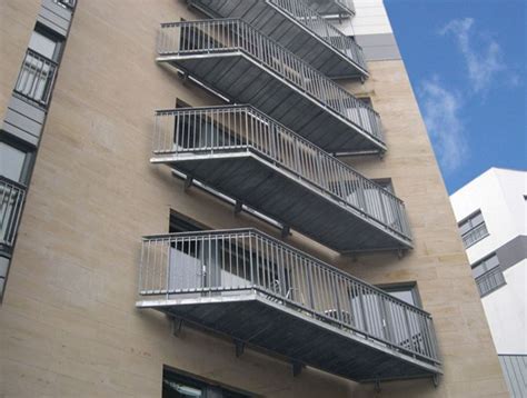 Mild steel cantilevered balcony designed to follow the contours of the building featuring ...