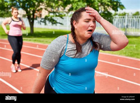 Exhausted runner touching her head with funny facial expression Stock ...