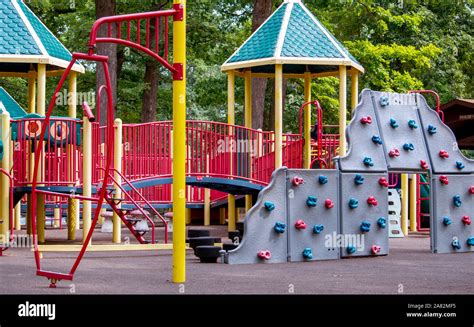 colorful playground with a climbing wall Stock Photo - Alamy