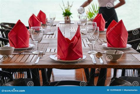 Set of Equipment on Wooden Dining Table in Restaurant Stock Photo - Image of napkin, plate ...