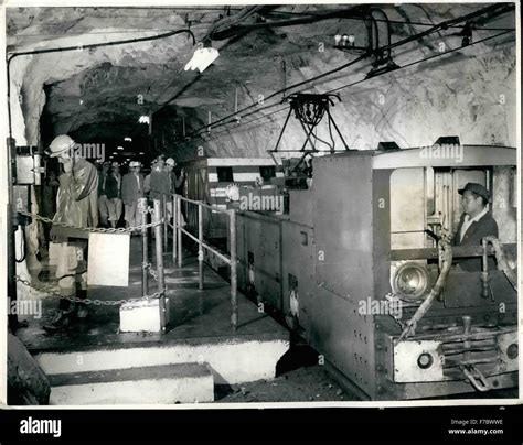 1962 - Gold Mines Of South Africa: Mine officials board an electric ...