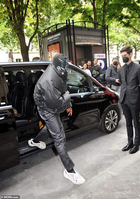 Kanye West, 44, goes undercover in black balaclava at Paris Fashion ...