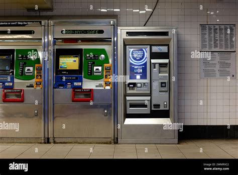 A NYC Subway OMNY ticket machine next to a Metrocard and single ticket ...