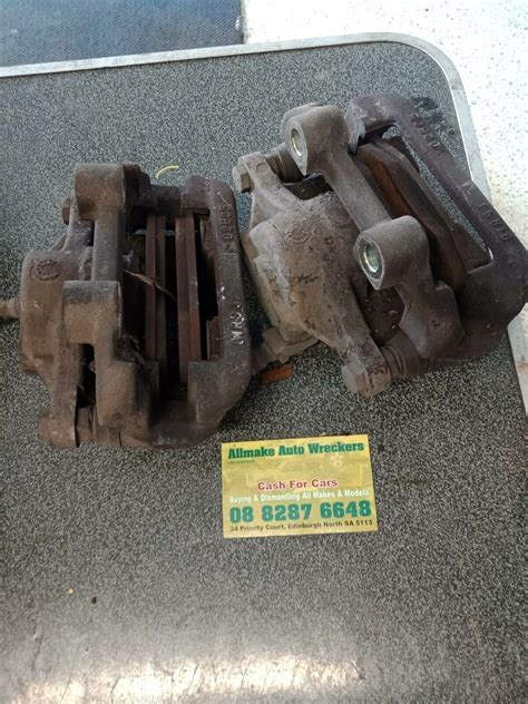 FORD EL EF FALCON PAIR REAR BRAKE CALIPERS CALIPER AND BRACKET - Allmake Auto Wreckers