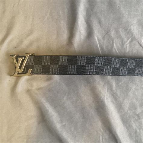 Louis Vuitton belt. Black and Grey with gold emblem.... - Depop