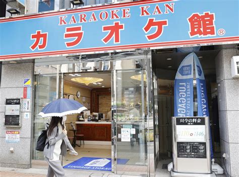 Tokyoites try "new normal" for singing as karaoke boxes reopen