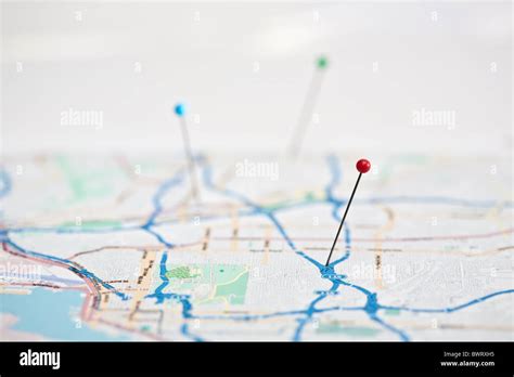 colored map pins in colorful paper map Stock Photo - Alamy