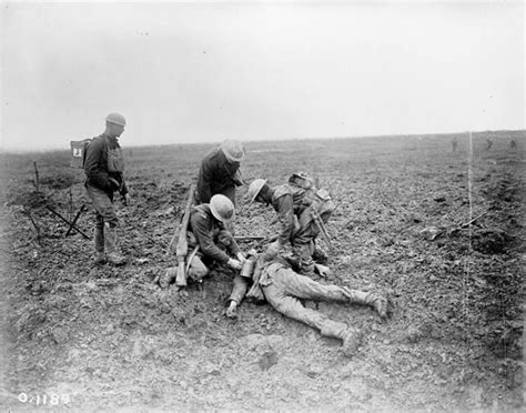 Soldiers treating a wounded German on the battlefield at Vimy Ridge ...