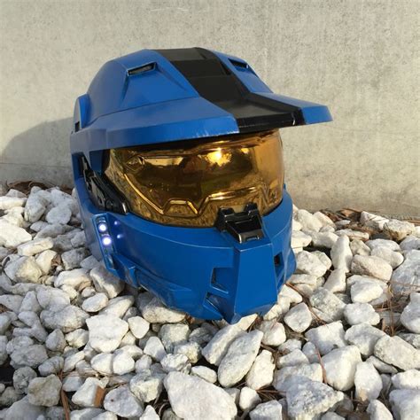 a blue helmet sitting on top of some rocks