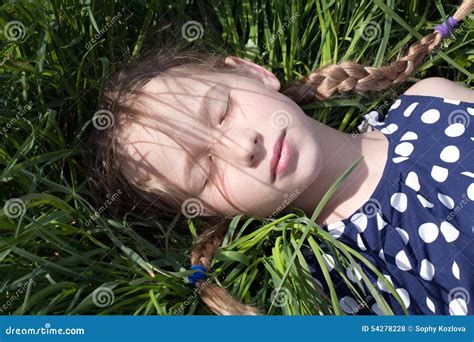 Young Girl Sleeping on Green Grass Stock Photo - Image of dress, funny: 54278228